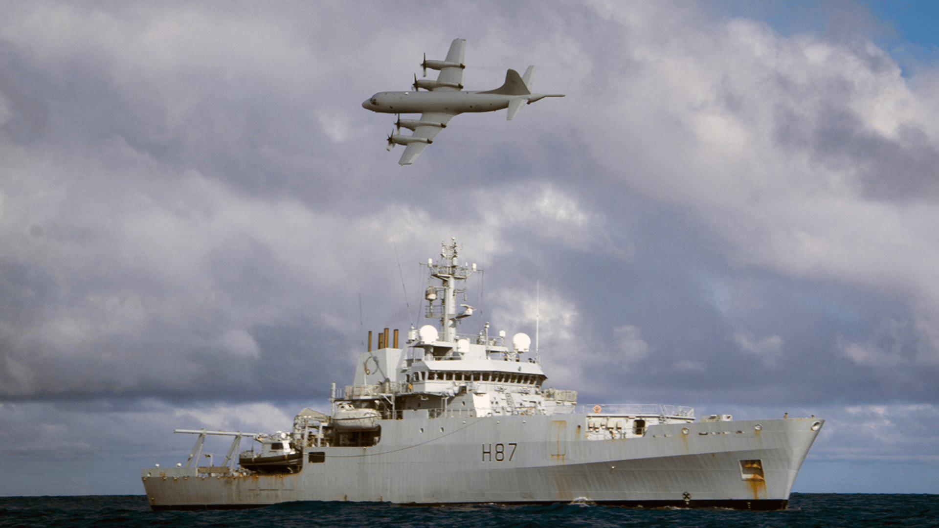 An Australian AP3C Orion Maritime Patrol Aircraft (MPA) flys over the Royal Navy survey vessel HMS Echo during the search for the Malaysian airliner Flight MH370 in the Indian Ocean.
