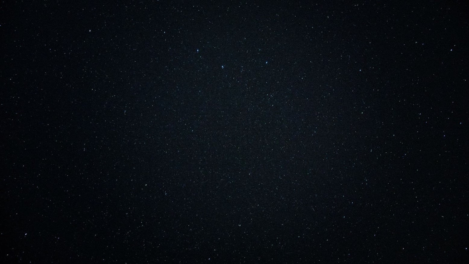A very dark night sky with stars.