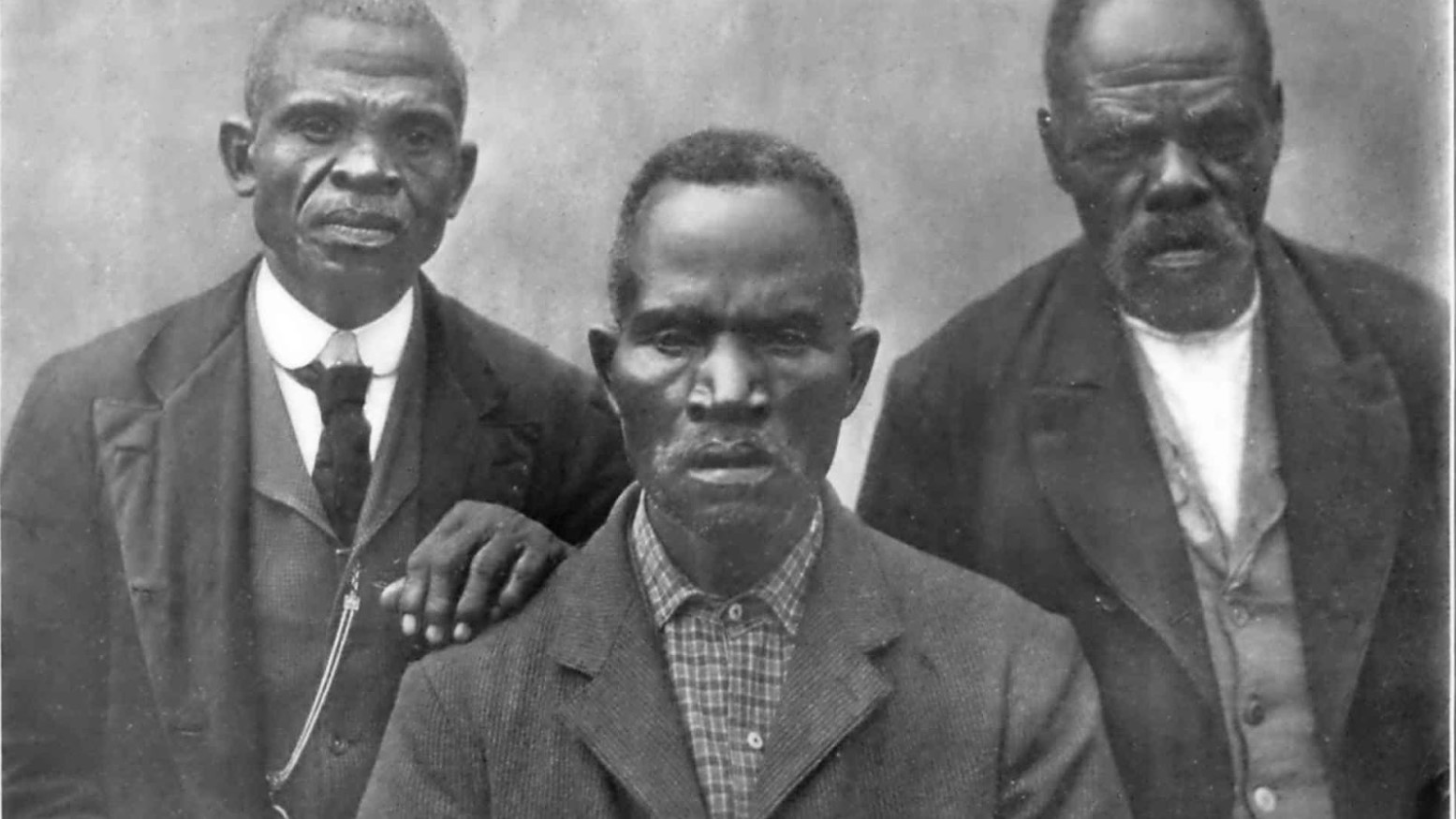 A portrait photograph of survivors of the slave trade taken in 1908.