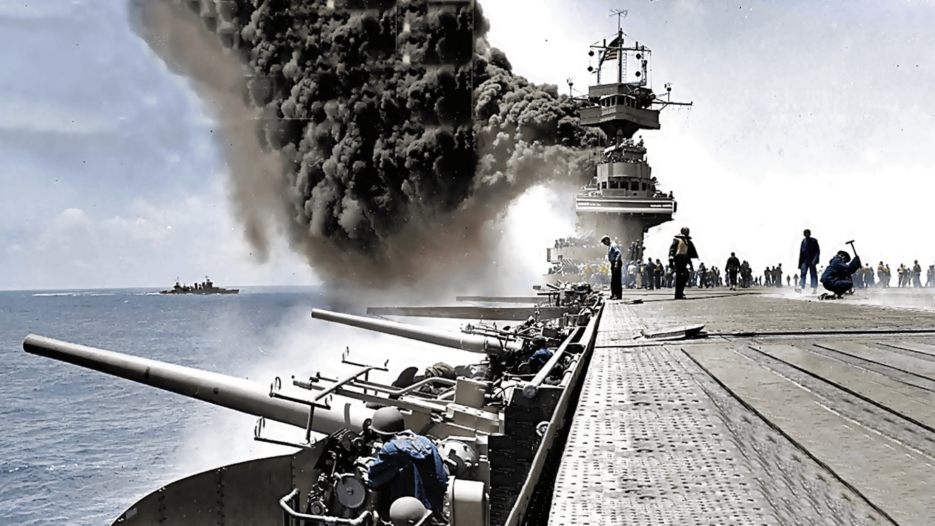 A partially colorized, partially black-and-white photo of the USS Yorktown (CV-5), during the Battle of Midway, 4 June 1942, shortly after she was hit by three Japanese bombs.