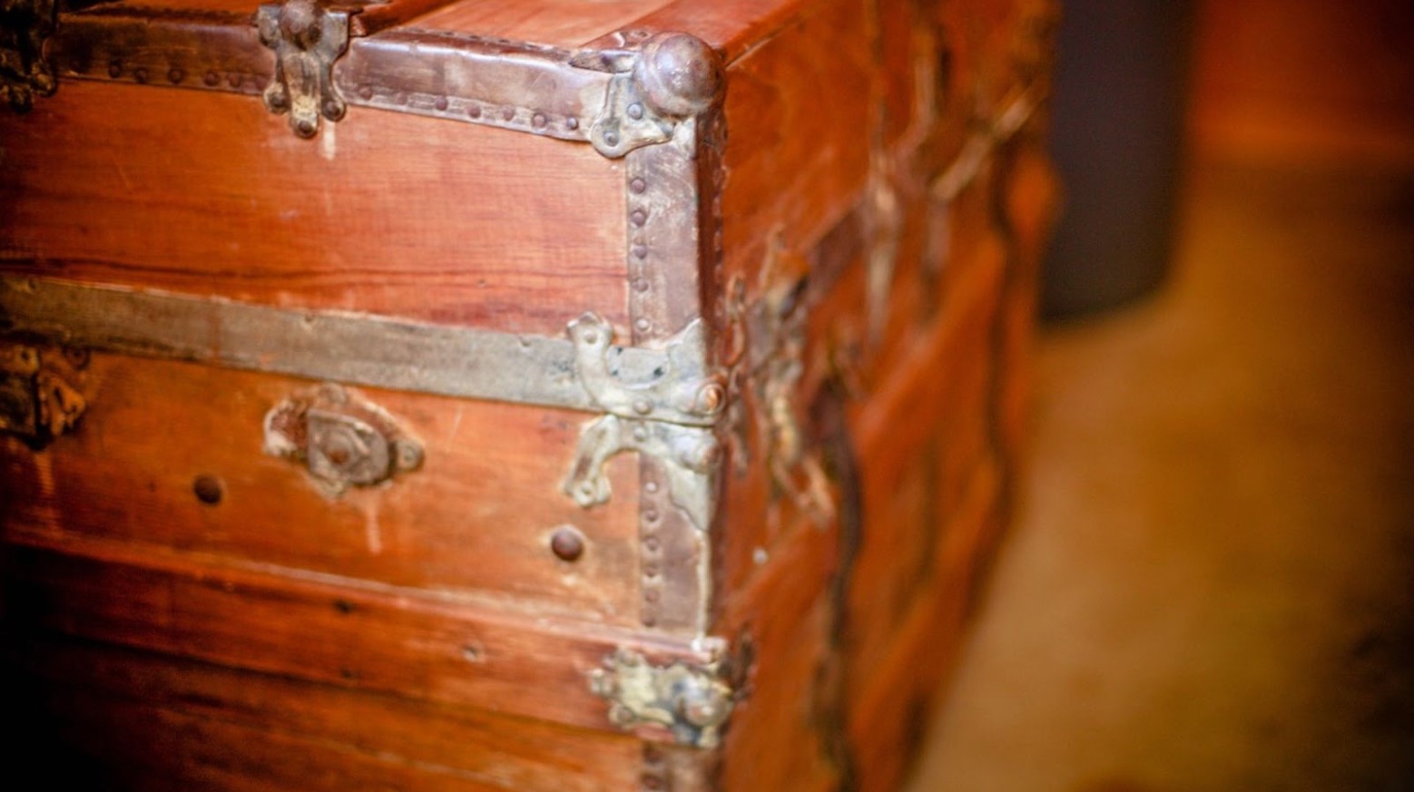 An old treasure box. It looks old and battered and is made of wood.