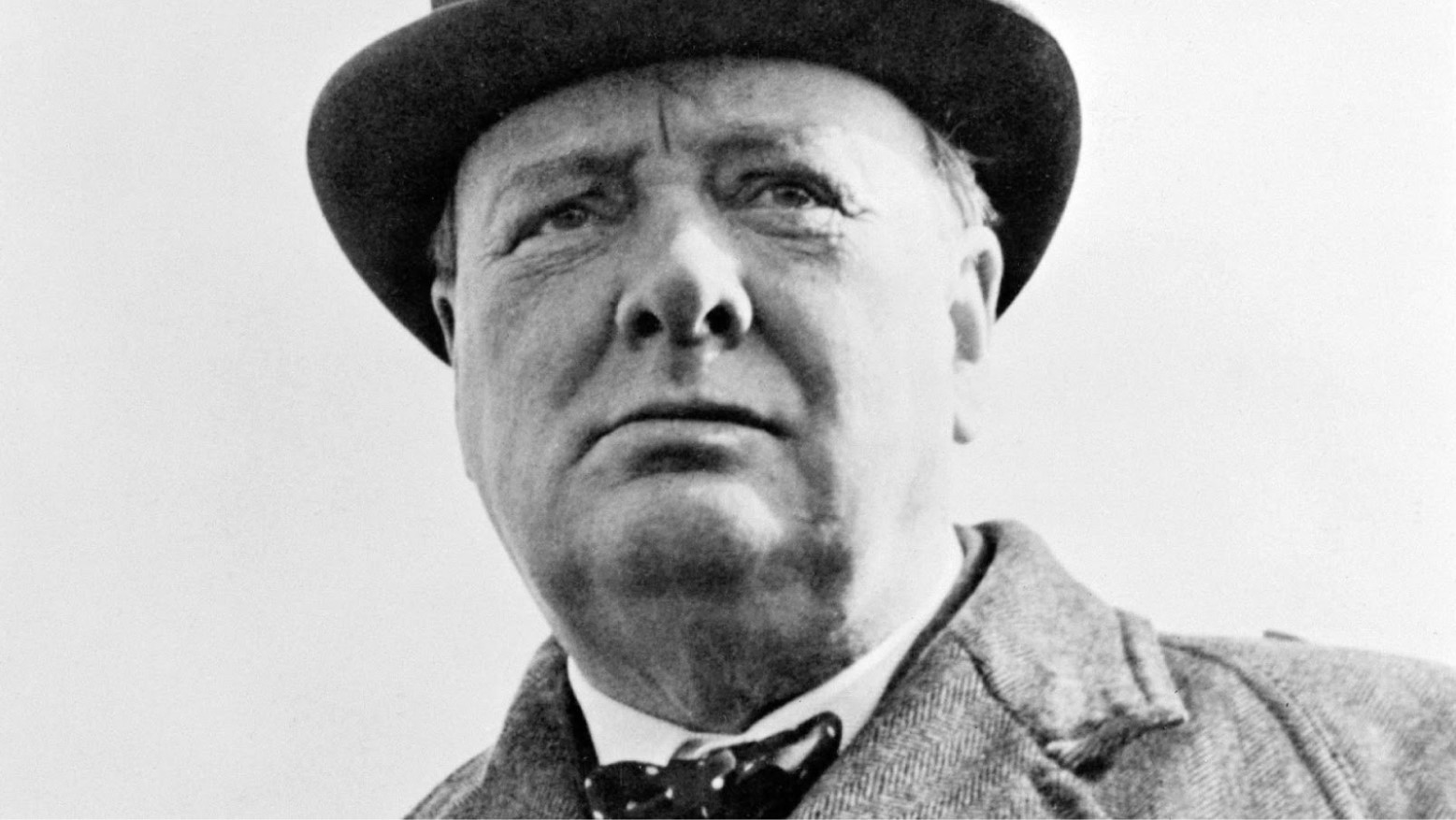 A black and white photo of Winston Churchill.