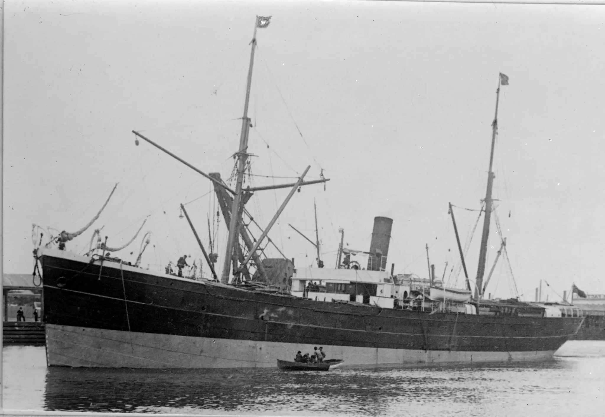 A gray scale image of the S.S. Nemesis in the sea