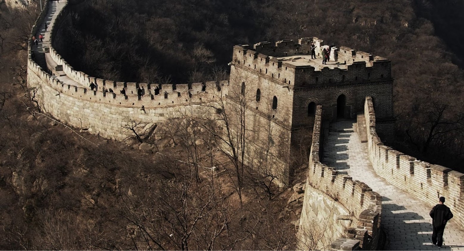 The Great Wall of China. People are walking across the wall at various points.