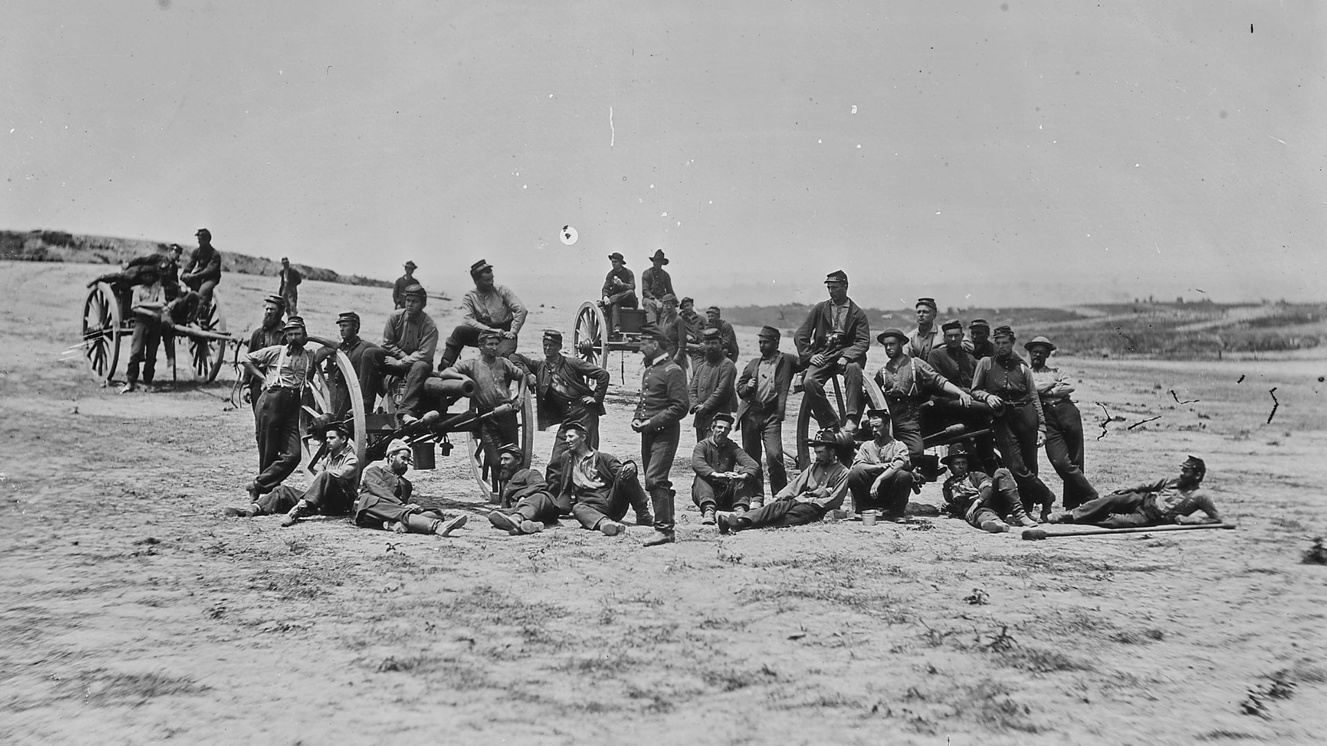 An 1860s black and white photo of Civil War soldiers at rest by Matthew Brady.