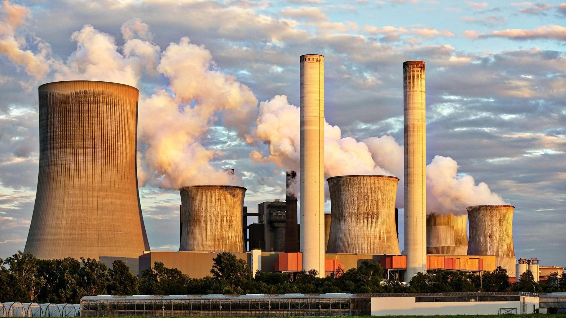 A landscape shot of smokestacks at a power plant.