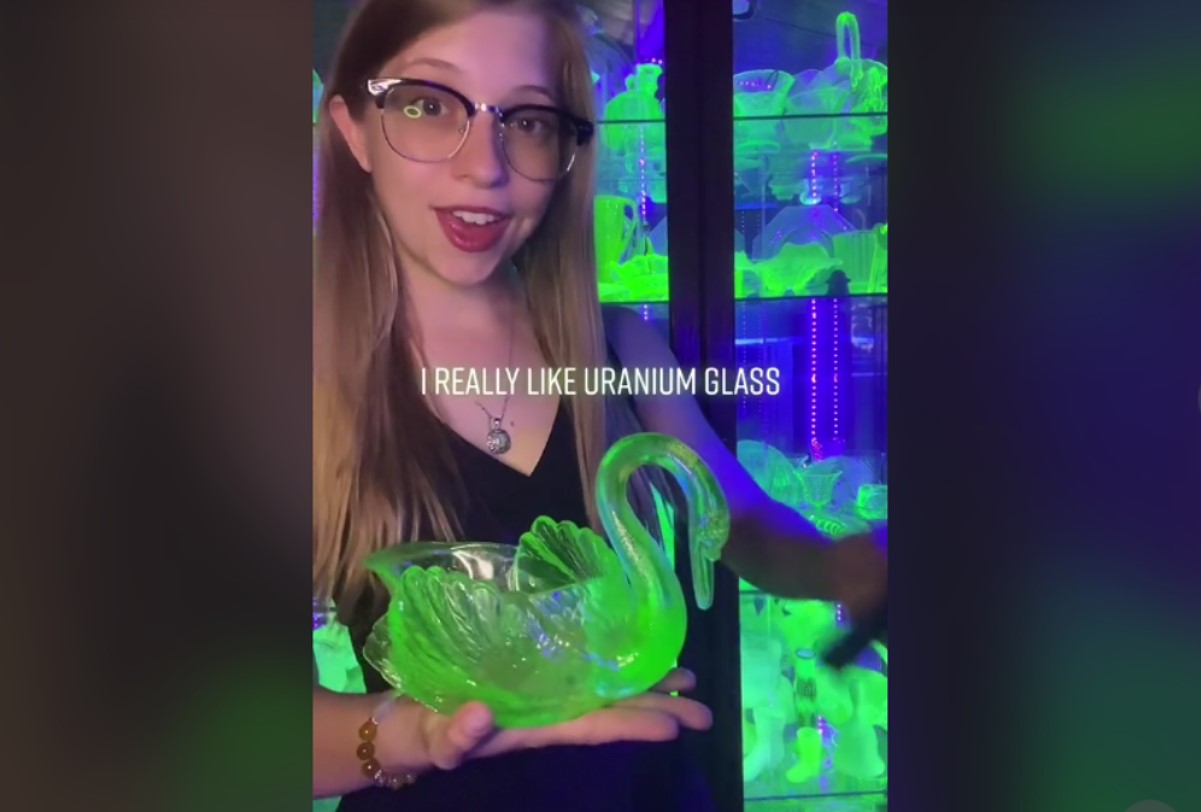 An image of @terrestrialtreasures showing off a large piece of uranium glass