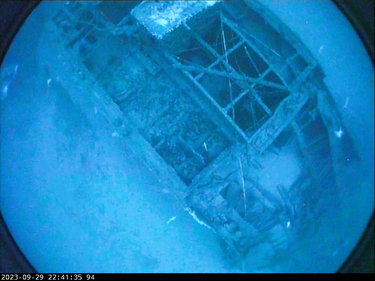 An underwater image of a sunken shipwreck