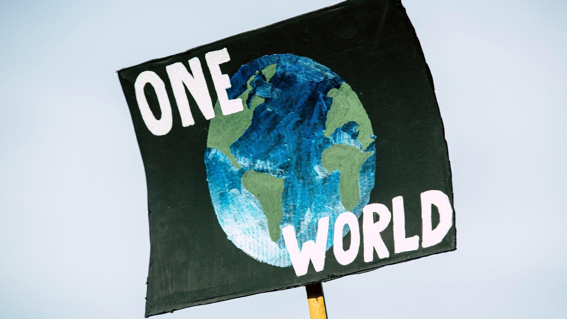 A climate change sign that features the planet Earth.