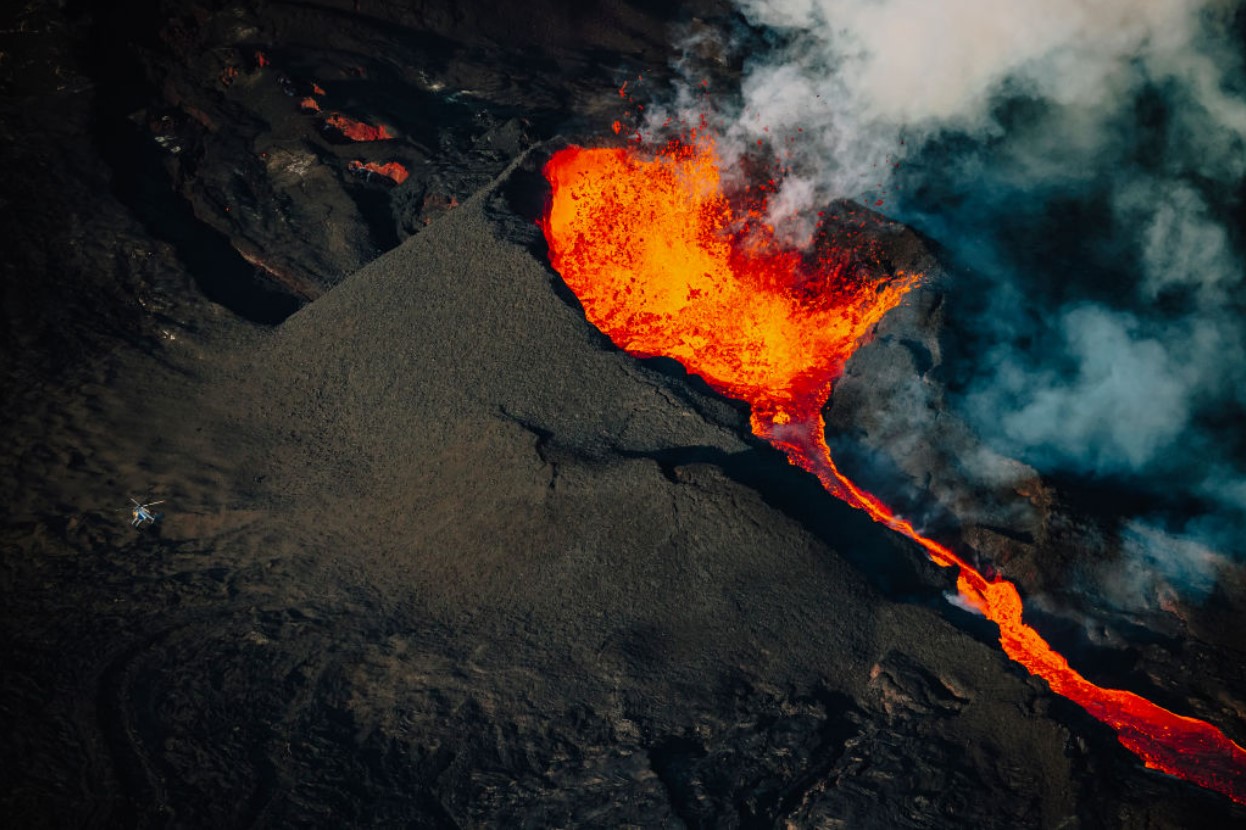 In an aerial view, lava erupts from the Mauna Loa Volcano on December 7, 2022 in Hilo, Hawaii