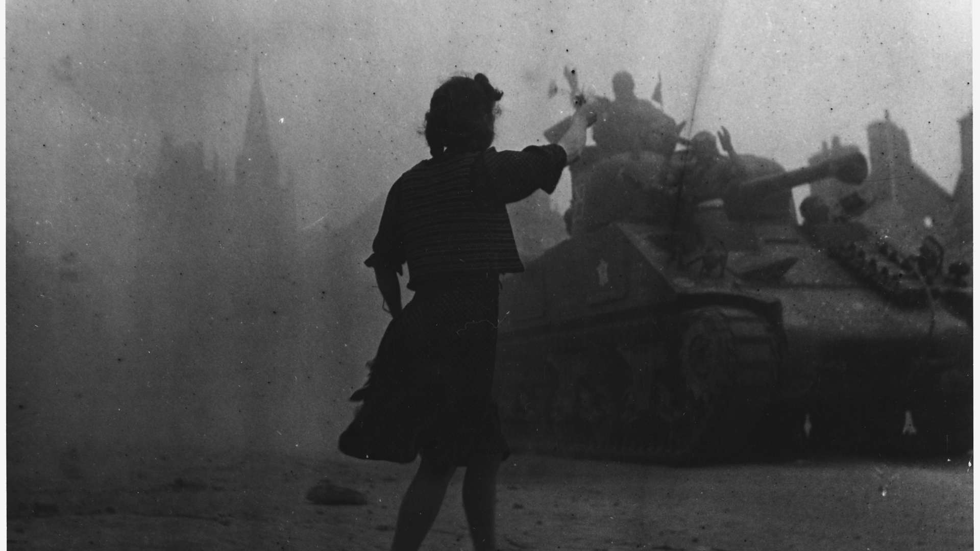Tanks roll through France during World War II.