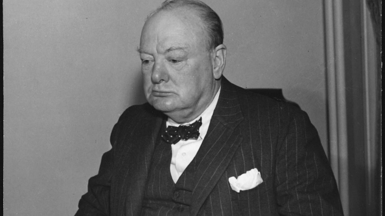 A black and white photo of Winston Churchill.