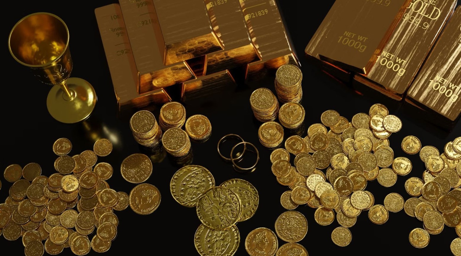 Various bits of gold that have been discovered. There are gold coins, bars of gold, and a gold cup.