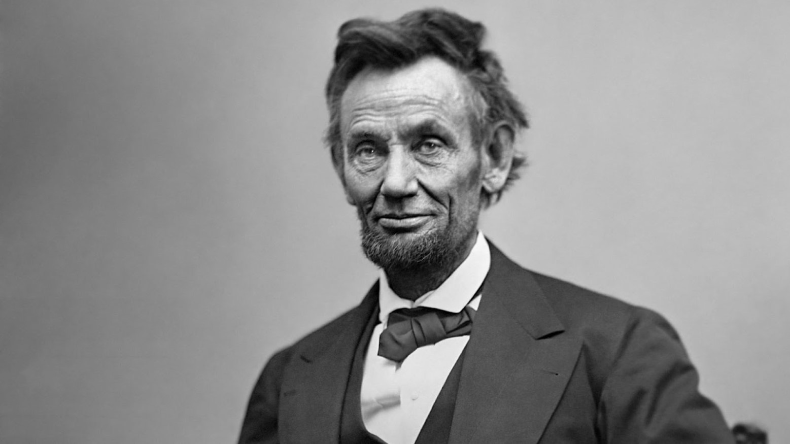 A black and white portrait photo of Abraham Lincoln in 1865.