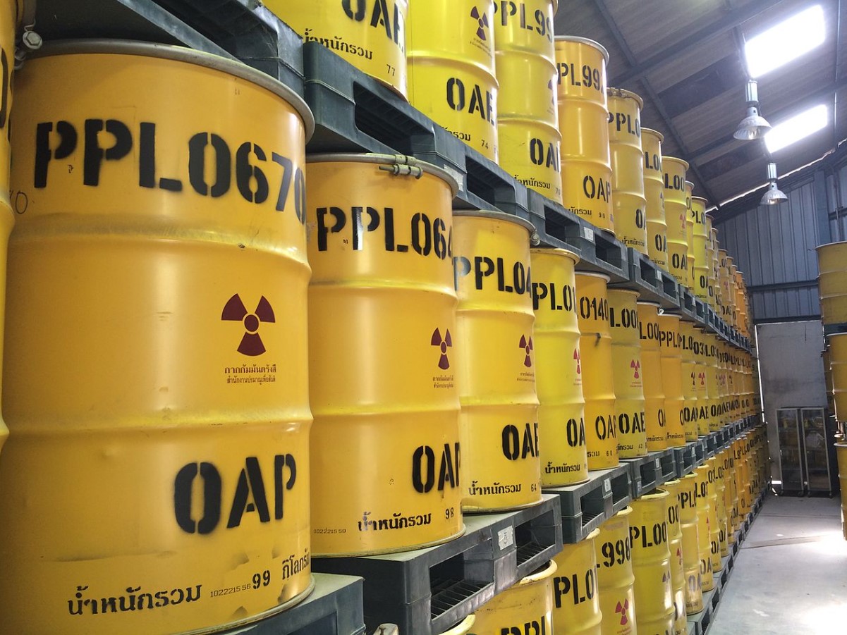 An image of numerous yellow barrels that contain radioactive waste