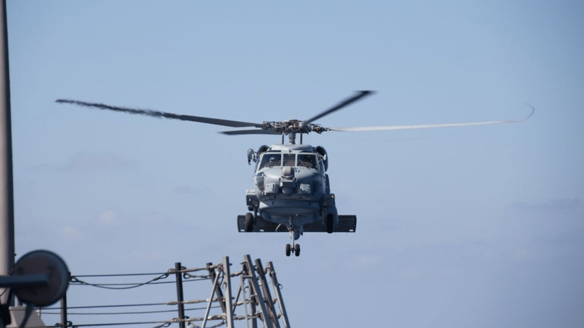 A U.S. Navy MH-60R Sea Hawk helicopter from the Arleigh Burke-class destroyer USS Pinckney (DDG 91) departs to aid in the search efforts of the missing Malaysia Airlines Flight MH370.
