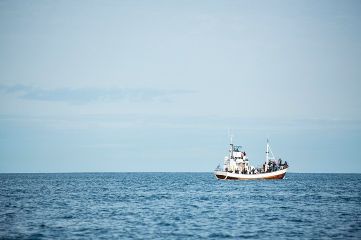 An image of a small search and rescue ship at sea