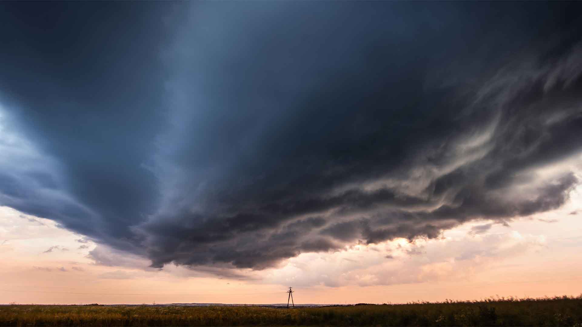Dark clouds over a field