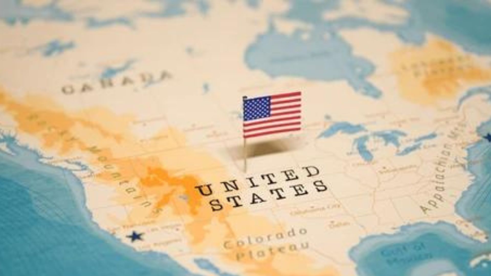 Map of the United States with an American flag placed in the center