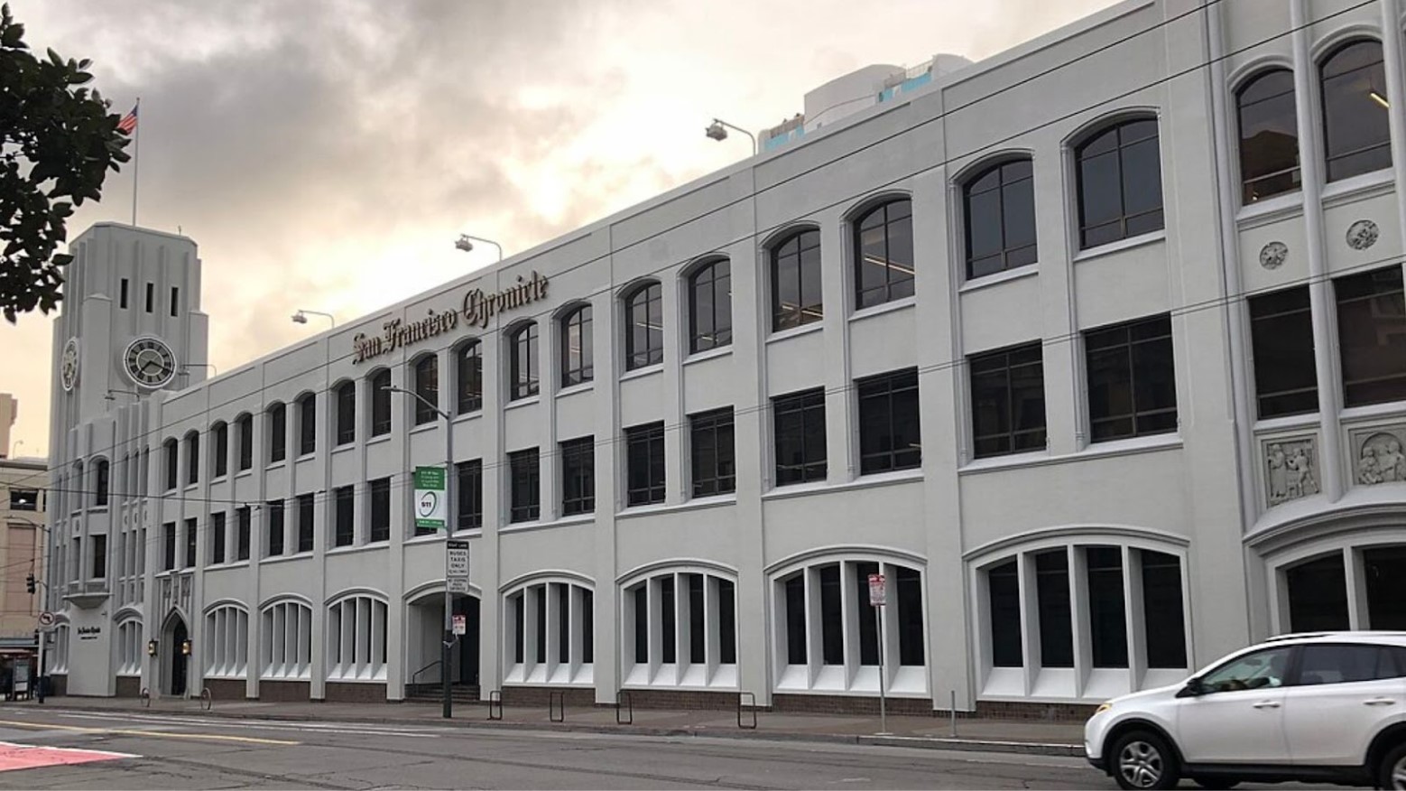 A large white building with a clock tower