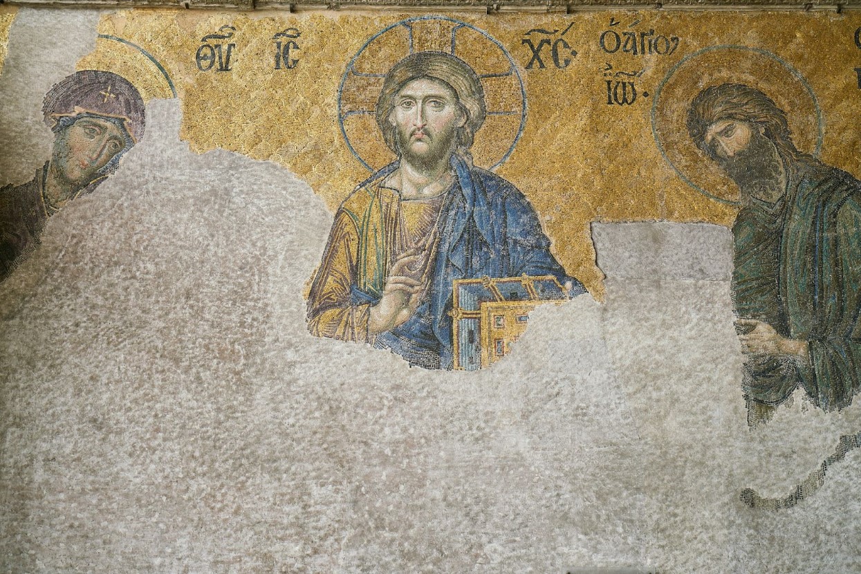 A wall painting of Jesus and other religious figures.