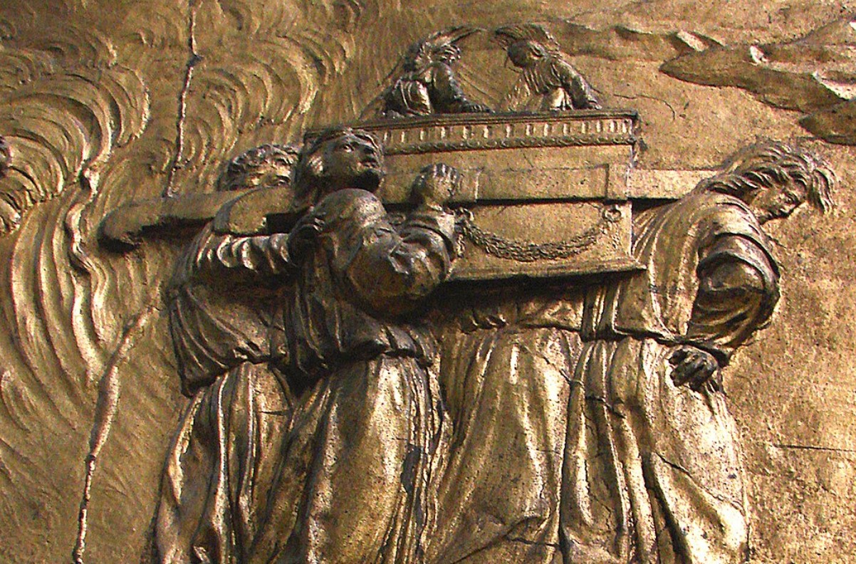 A metal relief depicting the Israelites carrying the Ark of the Covenant