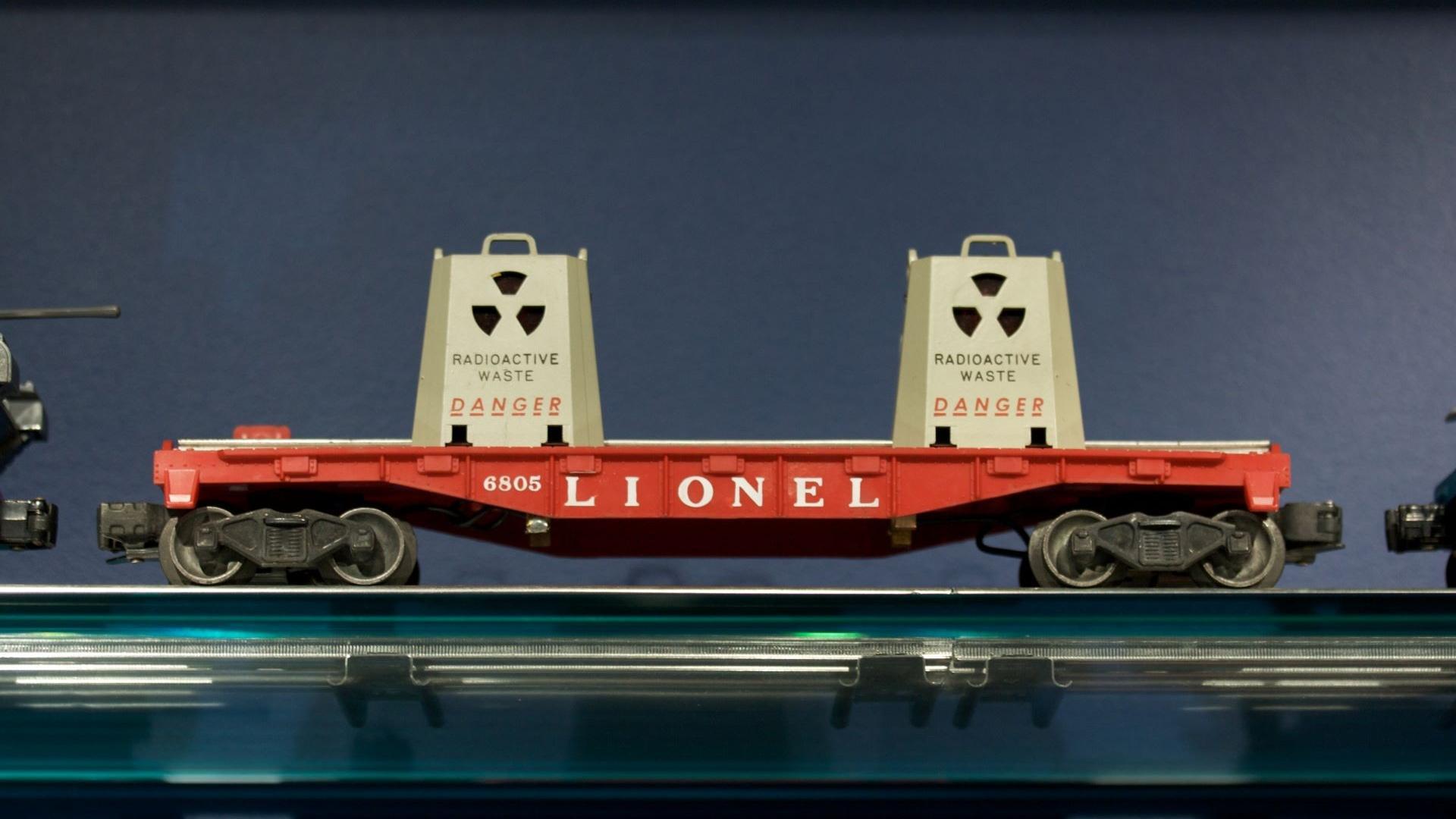 A cropped image of a model train carrying nuclear waste