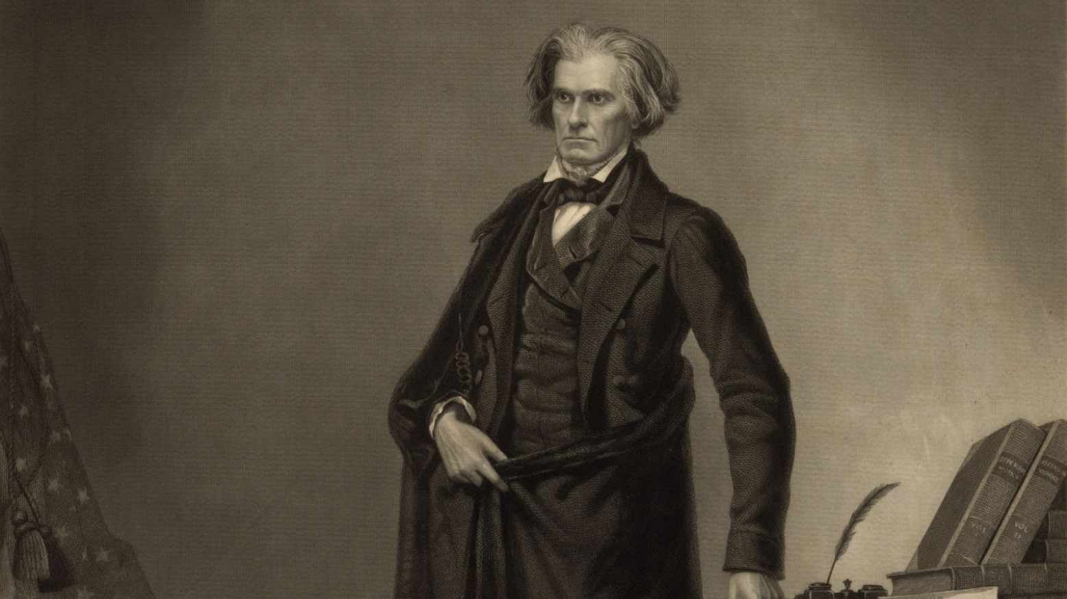 An 1852 photo of John Calhoun standing up wearing a suit.