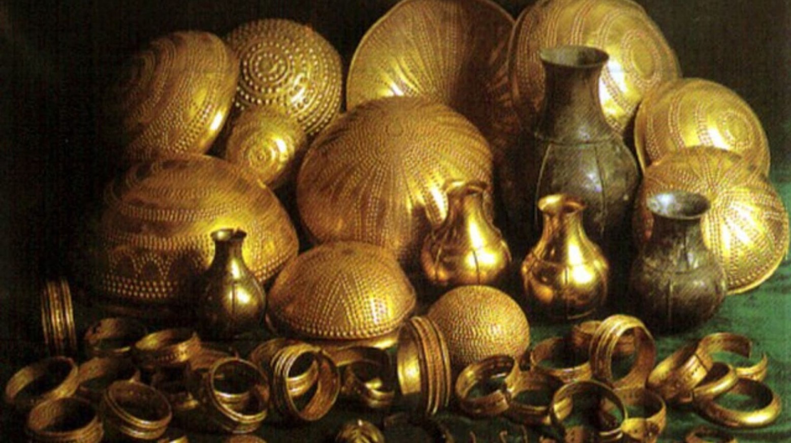 The Treasure of Villena. There are various gold bowls, bracelets, and other artifacts all piled together.