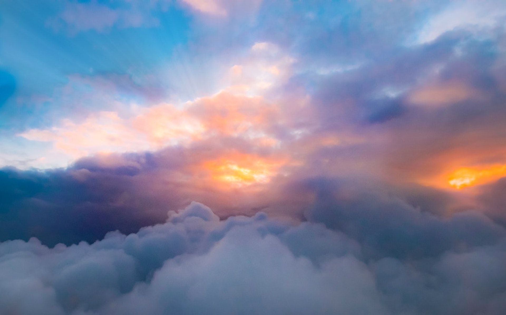 A sunrise over clouds in the early morning