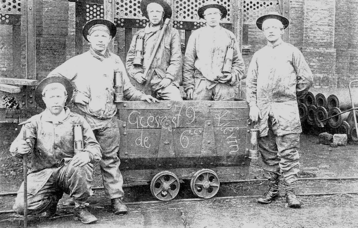 An image of several miners outside of the Courrières Mine