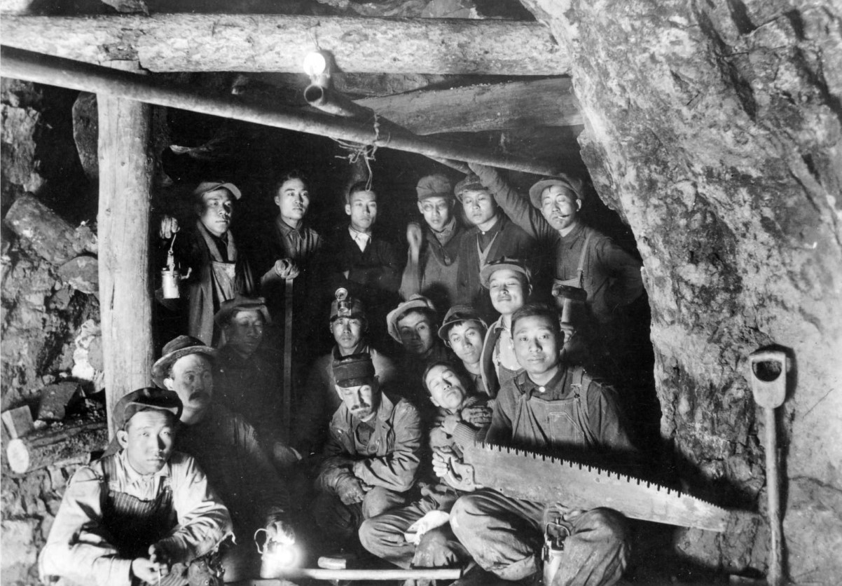 An image of a large amount of Chinese miners underground
