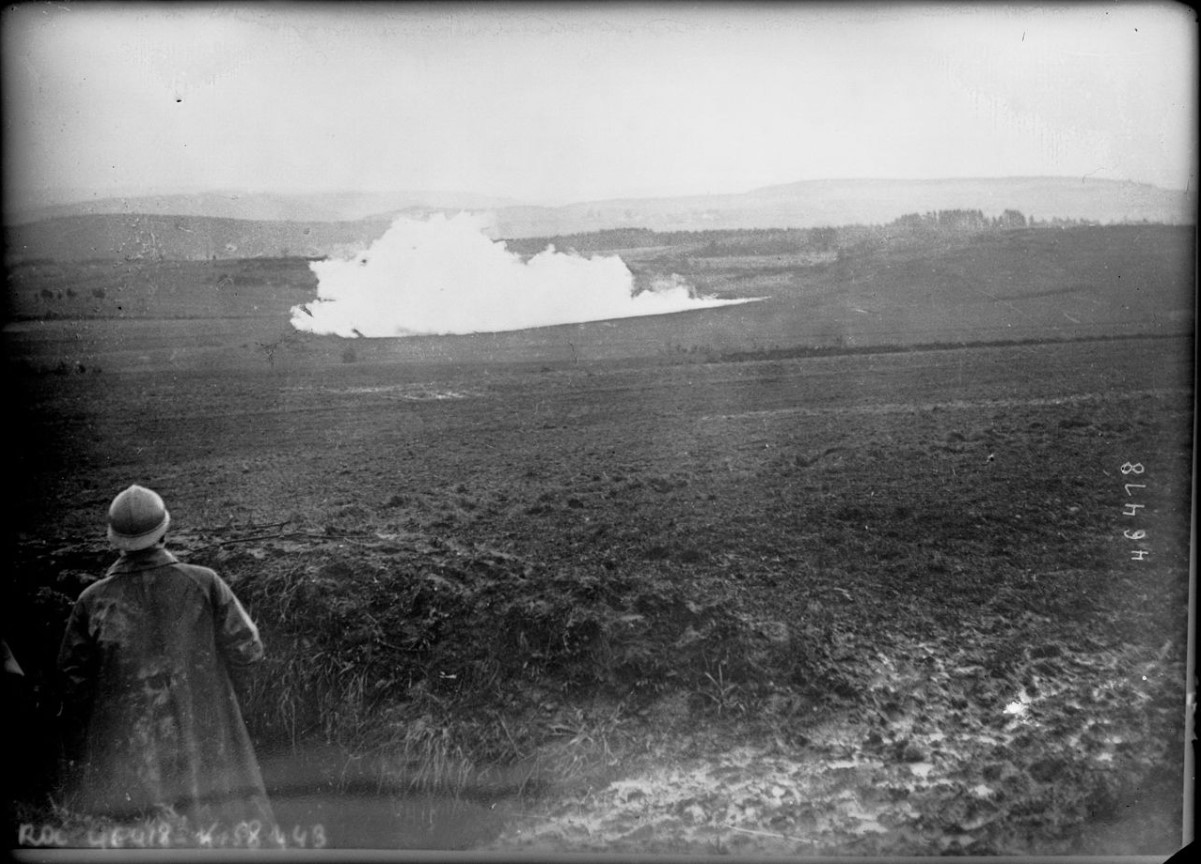 An image of a man as he watches an explosion at a nearby mine