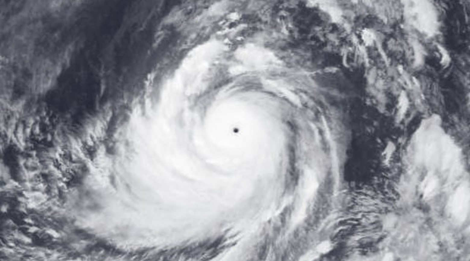 A satellite view of Typhoon Tip during the height of the storm. In the center is a hole, which is the eye of the storm.