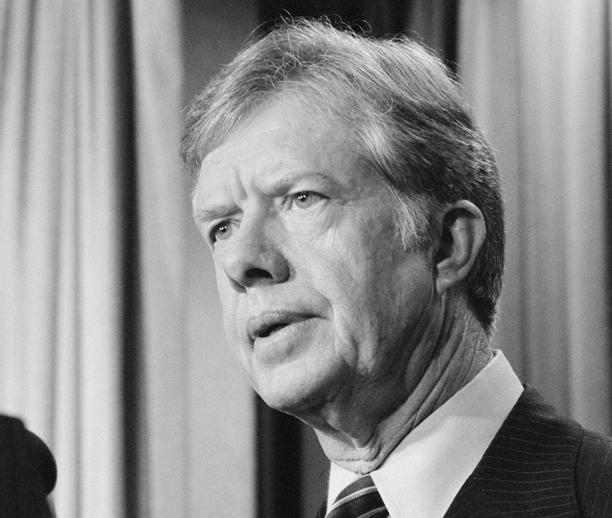 A black and white photograph of former US president Jimmy Carter