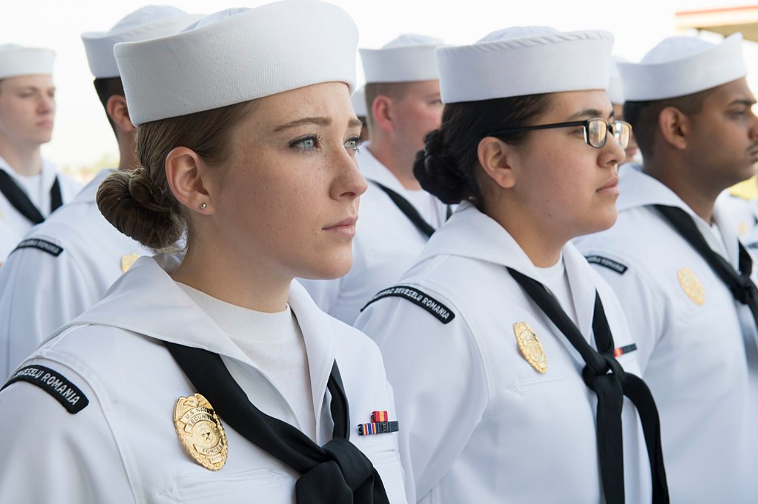 An image of several US Navy sailors dressed in uniform
