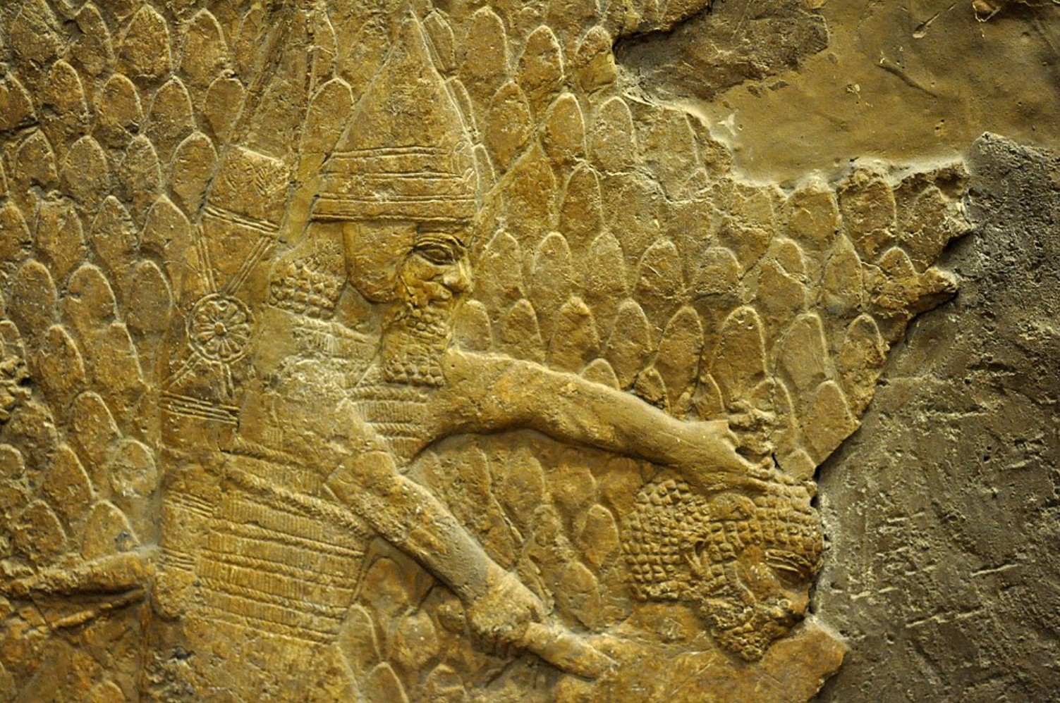 An image of an Assyrian soldier holding a blade to the throat of a prisoner
