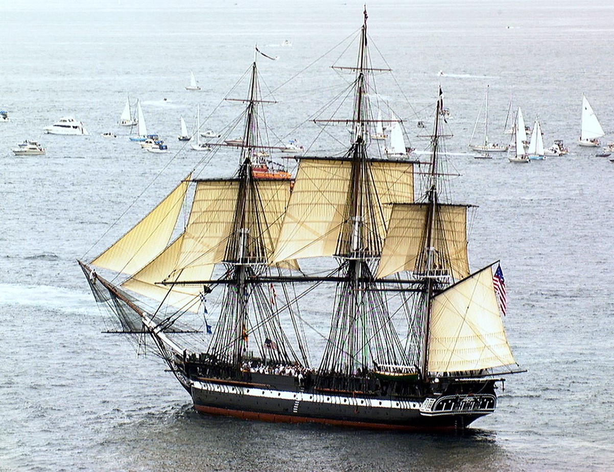 An image of an old US Navy ship floating in the water