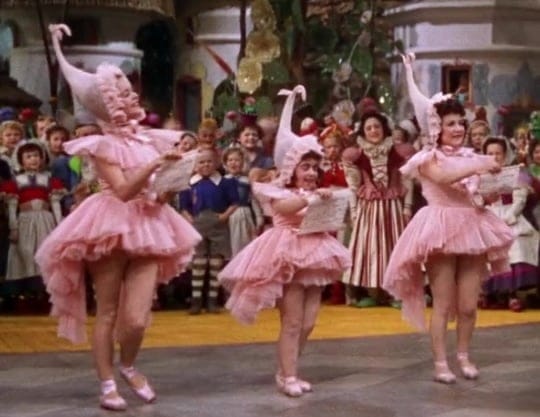 The Lullaby League in pink outfits in 'The Wizard of Oz'